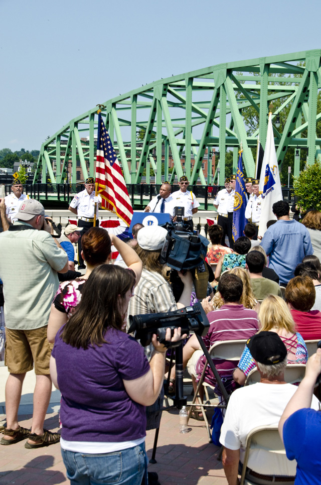 Governor speaks before attendees and press.