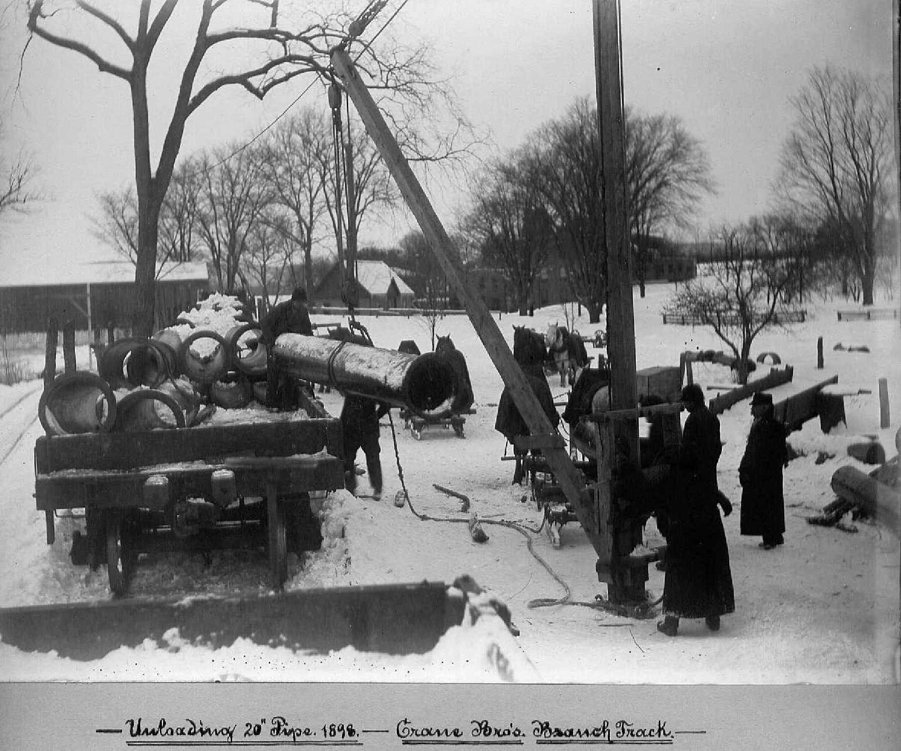 Workers with water pipe.